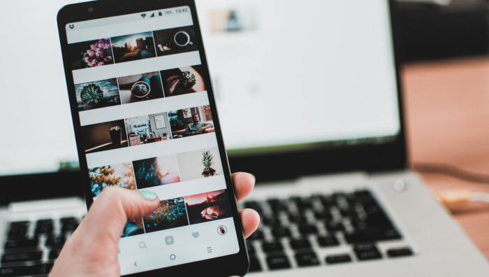 phone with open photos on screen